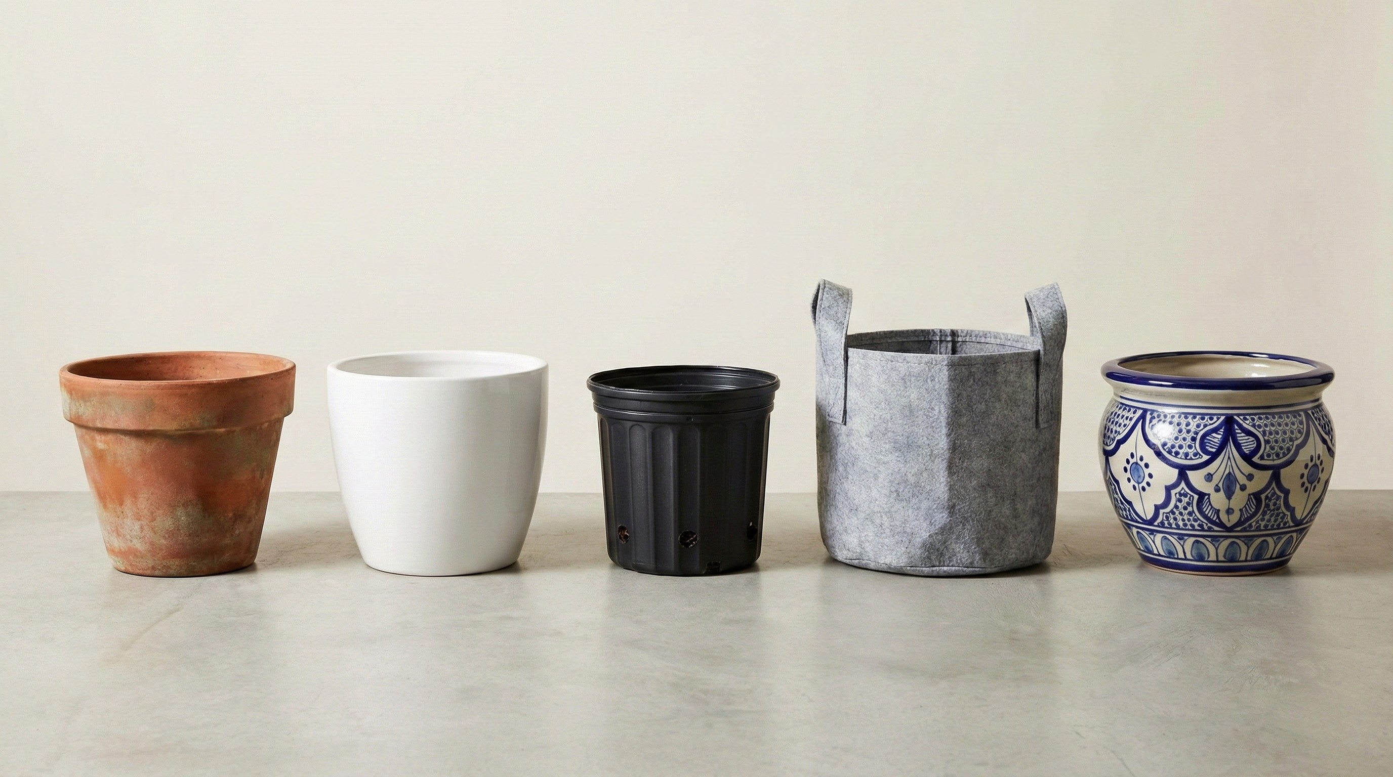 Collection of different pots: plastic nursery, terracotta, ceramic, fabric